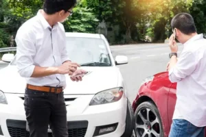 Person taking photos of car accident scene with car accident lawyers in Hillsboro Oregon