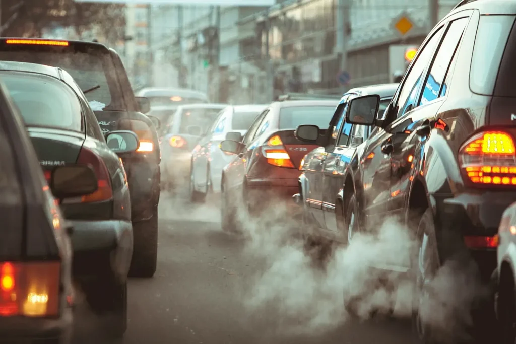 Cars in traffic, experiencing smog