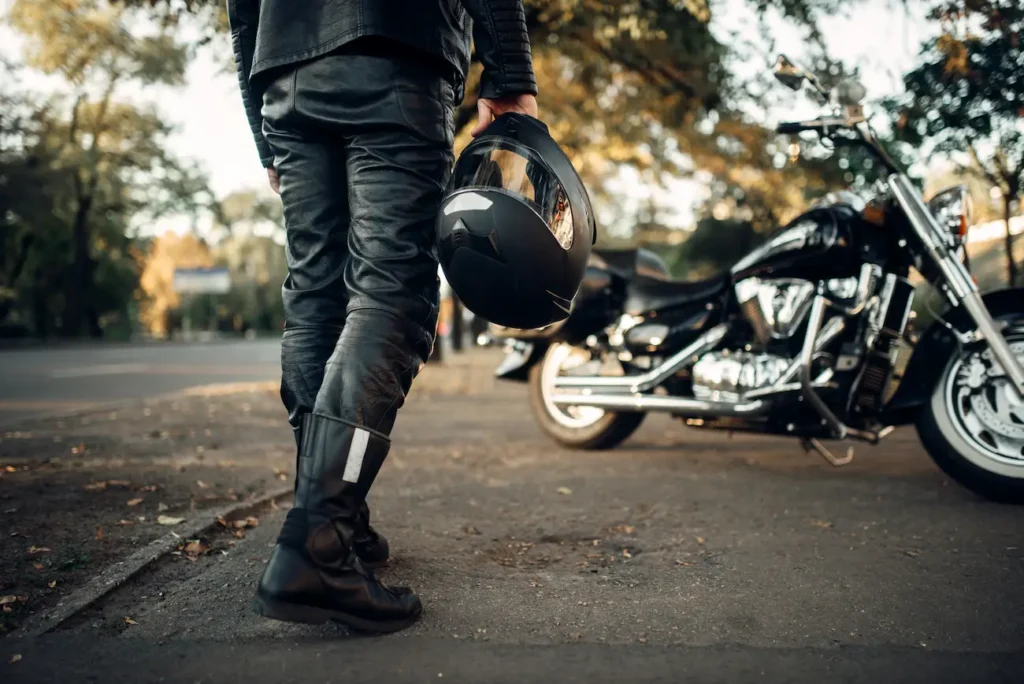 Man walking to motorcycle with helmet in hand consulting motorcycle accident attorney in Hillsboro Oregon