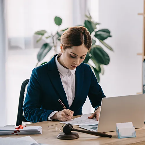 Lawyer reviewing legal documents at a desk