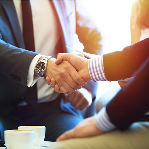 Lawyer consulting with client in an office while reviewing paperwork